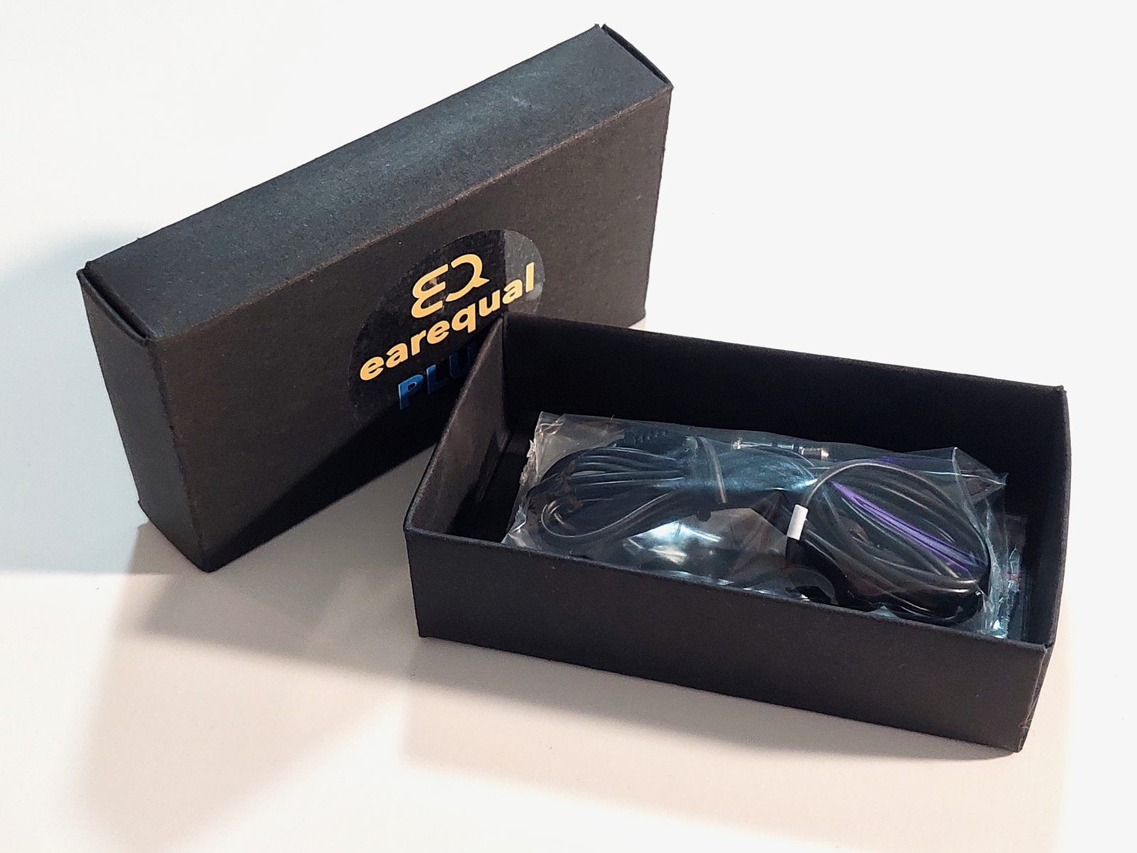 An EarEqual Plug packed in its box, sealed for hygiene