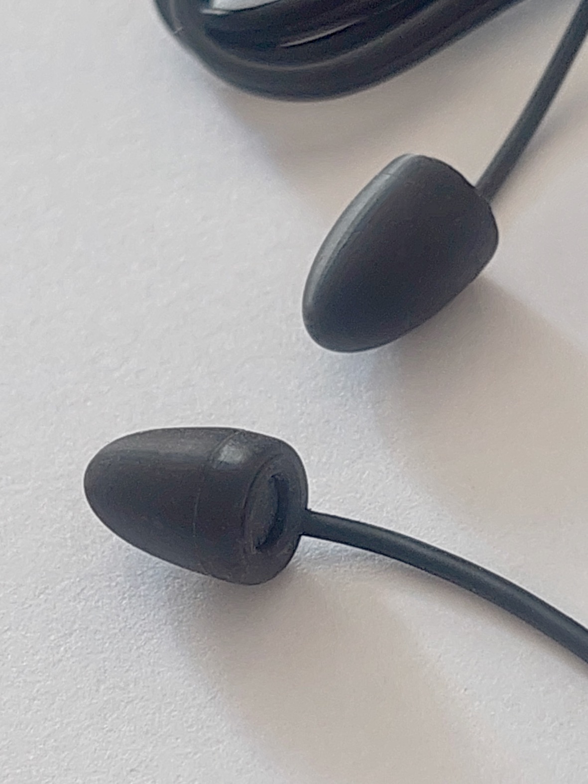 Close-up of the EarEqual Plug's silicone tip and embedded measurement microphone